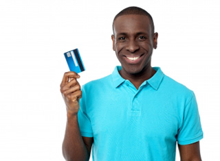 Person standing holding a credit card 